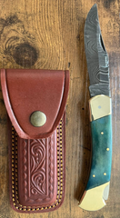Why do some chefs prefer knives with leather handles in professional kitchens?