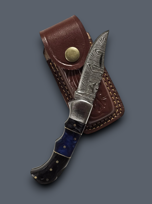 Handmade Damascus steel pocket knife with blue and black handle and premium brown leather sheath