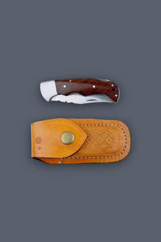A folding pocket knife with a dark brown wooden handle and silver blade, shown above its tan leather sheath on a solid dark gray background.