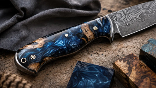 Damascus knife with blue wood and resin handle displayed with resin handle material samples