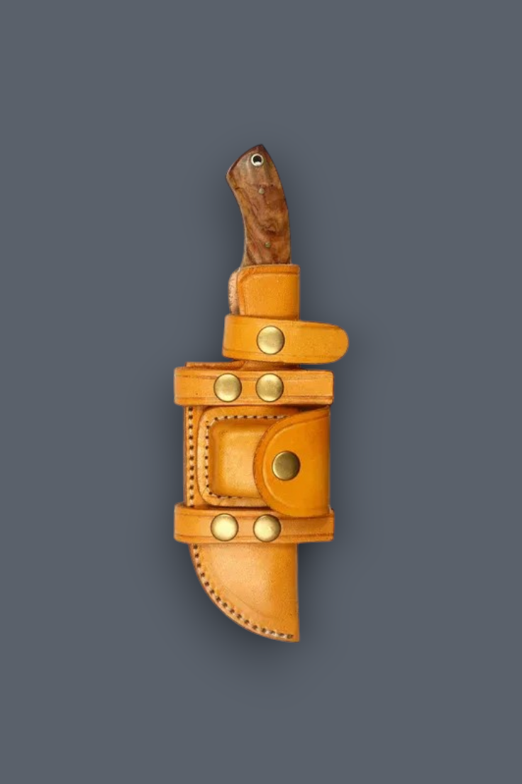 A tan leather knife sheath holding a knife with a dark wood handle, shown against a solid dark gray background.