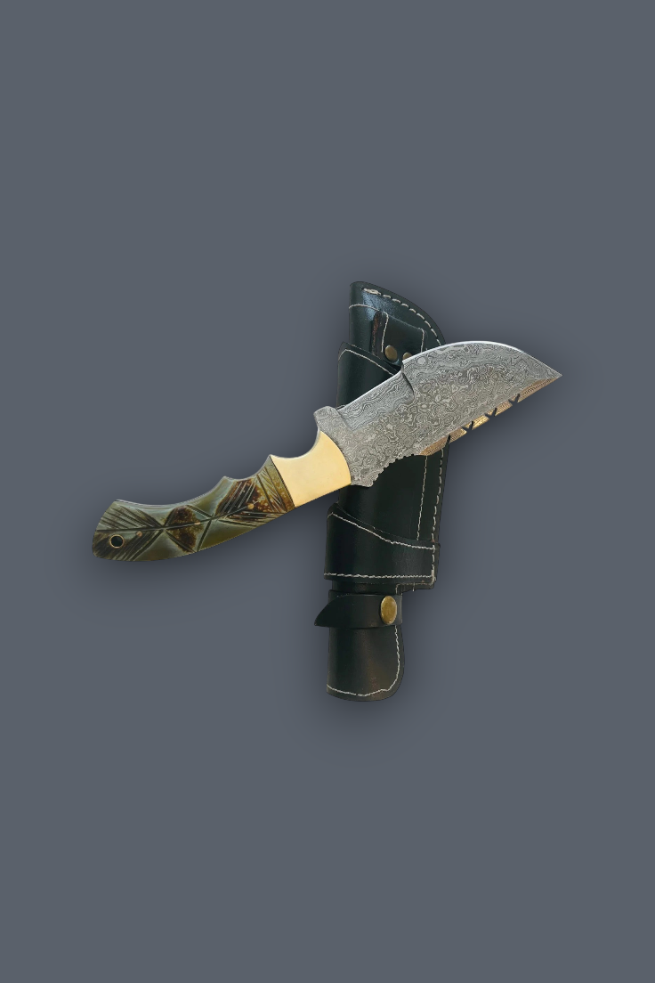 A fixed-blade knife with a textured silver blade, a patterned olive-green and gold handle, and a black sheath, displayed against a solid dark gray background.