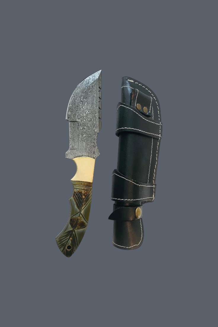 A fixed-blade knife with a patterned steel blade, gold-colored bolster, and textured olive-green handle, shown next to its black leather sheath on a solid dark gray background.