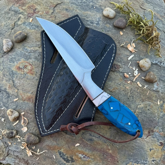 Fixed blade knife with turquoise patterned resin handle and black leather sheath

