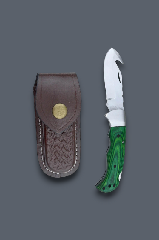 A fixed-blade knife with a green marbled handle and silver blade, shown next to a brown leather sheath with a brass snap button, on a solid dark gray background.