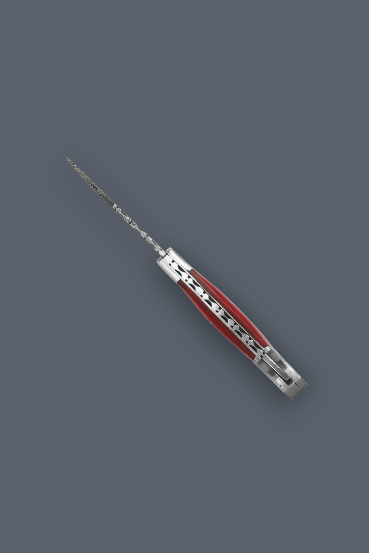 A folding pocket knife with a silver-toned metal body and a red handle inlay, shown open against a solid dark gray background.