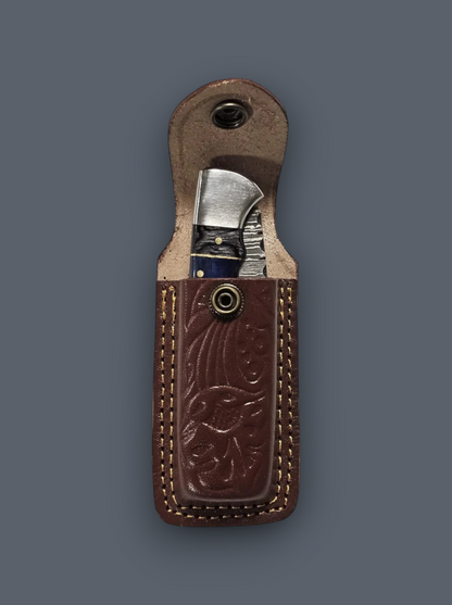 Damascus steel EDC pocket knife with ergonomic blue handle and genuine leather carrying pouch