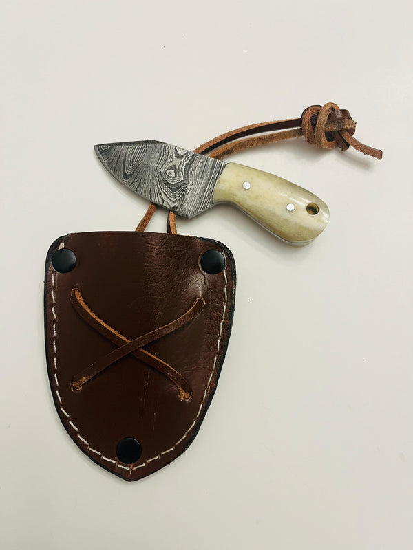 MB-101. Miniature Damascen bone handle skinner knife. Blade size 2” handle size 1.5” total length 3.5” with genuine leather sheath