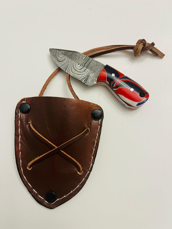 MR-102. Miniature Damascen resin handle skinner knife. Blade size 2” handle size 1.5” total length 3.5” with genuine leather sheath