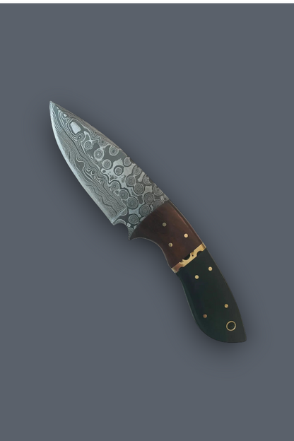 A decorative fixed-blade knife with a patterned Damascus-style steel blade, a brown handle, and gold-colored rivets, shown diagonally on a solid dark gray background.