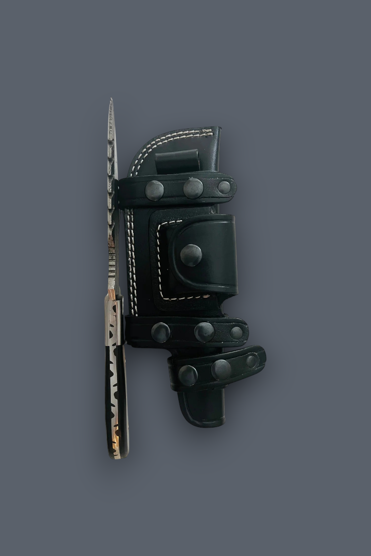 A folding knife with a textured dark handle and a black leather sheath with silver rivets, displayed vertically on a solid dark gray background.