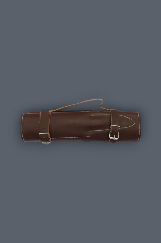 A brown leather cylindrical case with two buckle straps and a top loop handle, shown against a solid dark gray background.