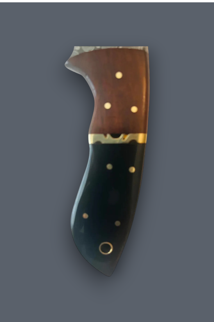 A decorative knife handle with a curved shape, featuring a brown wood upper section, a gold-colored metal band, and a dark black lower section, all adorned with small gold inlays.