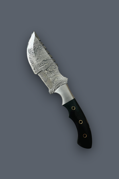 A fixed-blade knife with a patterned Damascus steel blade and a black handle secured by brass rivets, shown diagonally on a solid dark gray background.