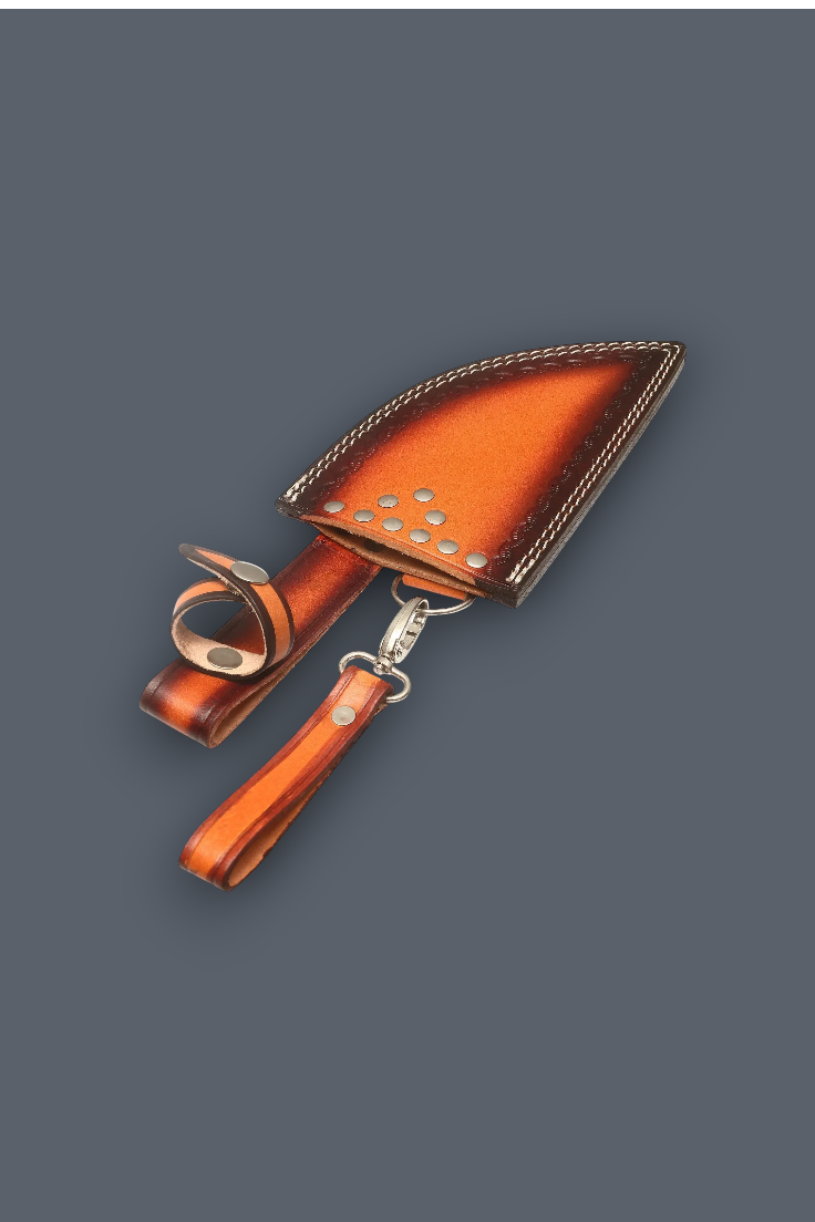 A brown leather knife sheath with a matching wrist strap and metal snap clasp, shown on a solid dark gray background.