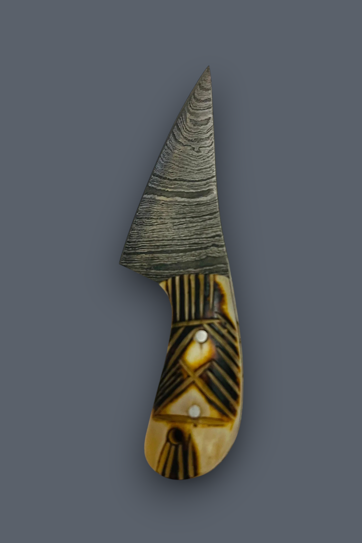 A small fixed-blade knife with a patterned Damascus-style steel blade and a carved handle made of alternating dark brown wood and light tan bone or horn, shown on a solid dark gray background.