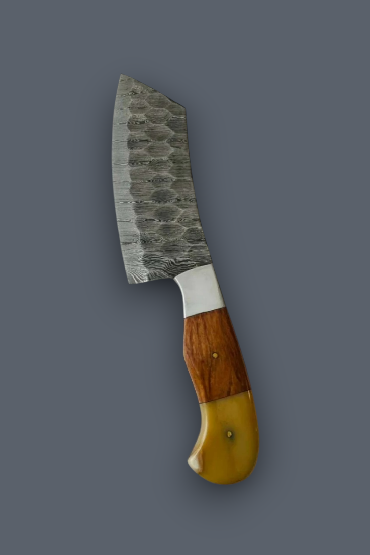 A kitchen knife with a patterned steel blade, a silver bolster, and a dual-tone wooden handle in brown and yellow, shown against a solid dark gray background.