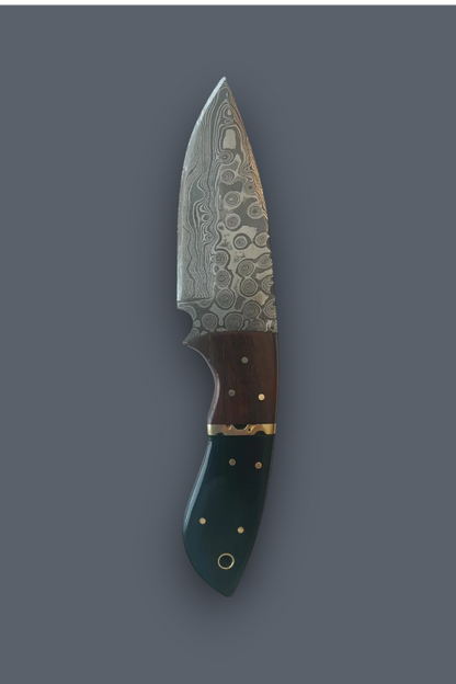 A fixed-blade knife with a patterned Damascus-style steel blade, a dark brown wooden handle section, and a dark green handle with brass pins, shown against a solid dark gray background.