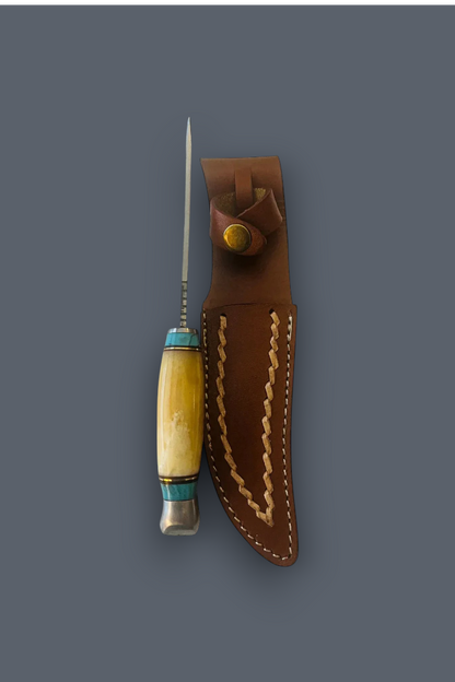 A fixed-blade knife with a light wood handle and turquoise accents, shown next to its brown leather sheath with decorative stitching, on a solid dark gray background.