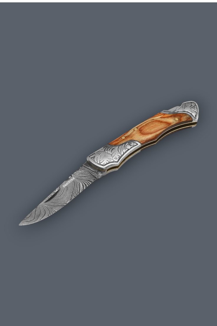 A folding pocket knife with a Damascus steel blade and an ornate handle made of layered brown wood and silver metal, shown on a solid dark gray background.