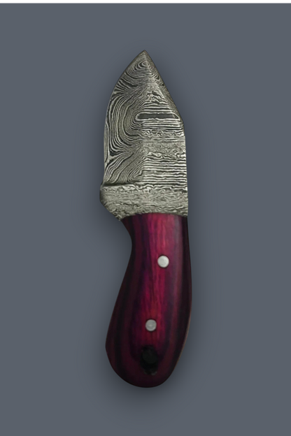A small fixed-blade knife with a patterned Damascus-style steel blade and a dark reddish-brown wooden handle with silver rivets, shown on a plain gray background.