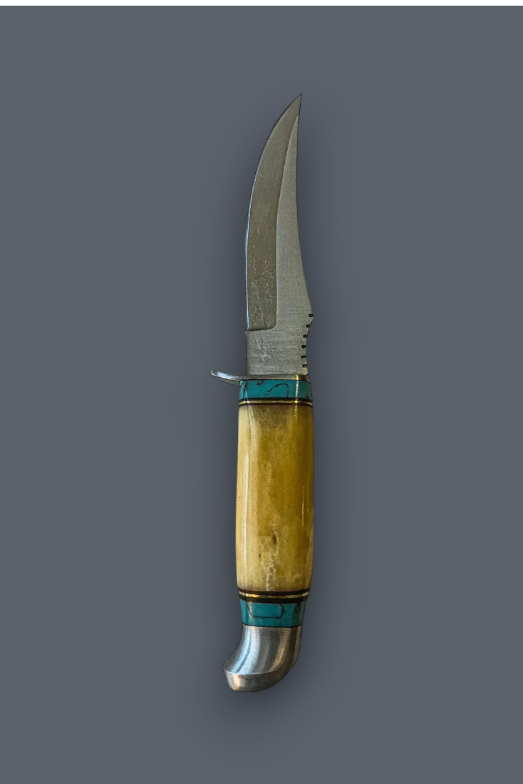 A fixed-blade knife with a curved silver steel blade, a natural bone handle showing warm yellow and beige tones, and turquoise-colored inlay bands, set against a solid dark gray background.