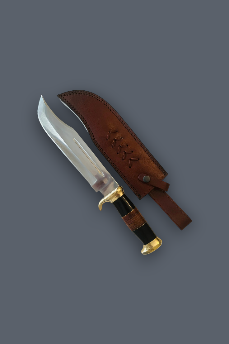 A fixed-blade knife with a curved silver blade, gold-toned guard and pommel, and a black wrapped handle, shown next to its brown leather sheath on a plain gray background.