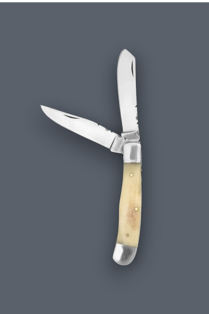 A folding pocket knife with two blades partially open, featuring a light natural bone or horn handle and silver-toned metal blades and bolsters, shown against a solid dark gray background.