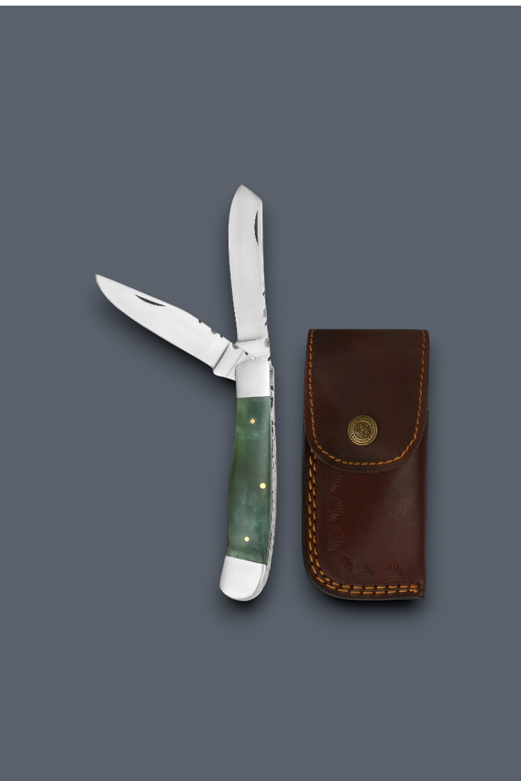 A folding pocket knife with a green handle and silver blade, shown next to its brown leather sheath on a dark gray background.
