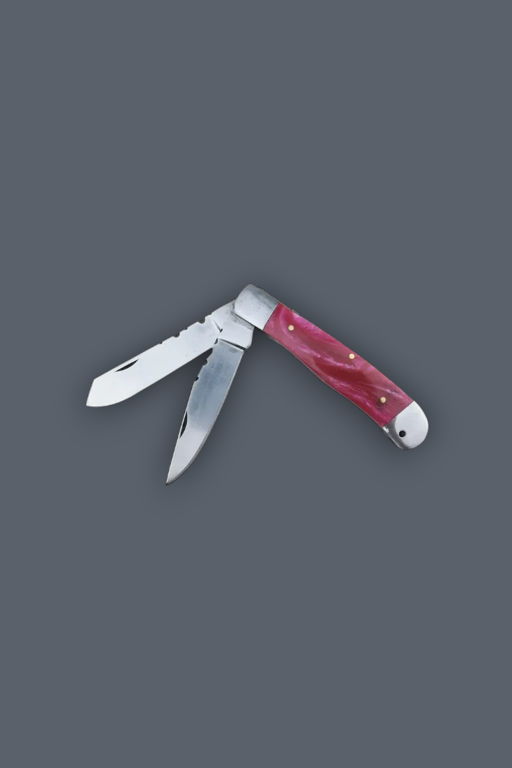 A classic folding pocket knife with a reddish-pink bone handle and silver stainless steel blades, shown open against a solid dark gray background.