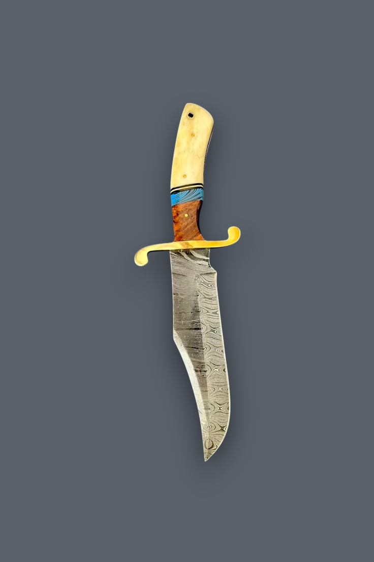 A custom fixed-blade knife with a patterned steel blade, a yellow-gold curved guard, and a multi-colored handle made of cream bone, blue inlay, and brown wood, shown against a solid dark gray background.