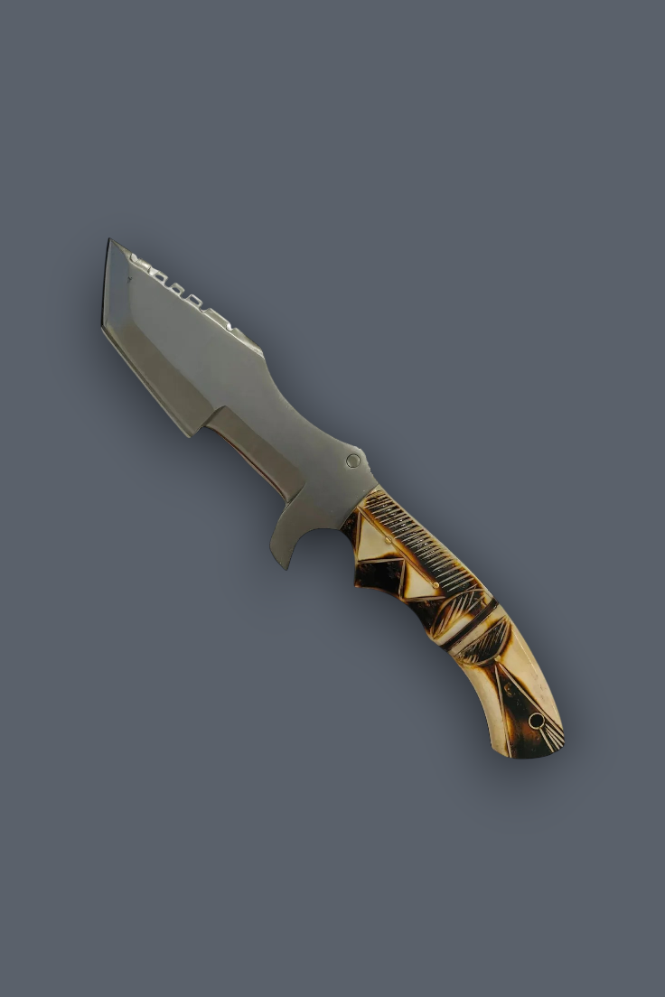 A fixed-blade knife with a matte gray steel blade and a decorative handle featuring a gold and black pattern, shown on a solid dark gray background.