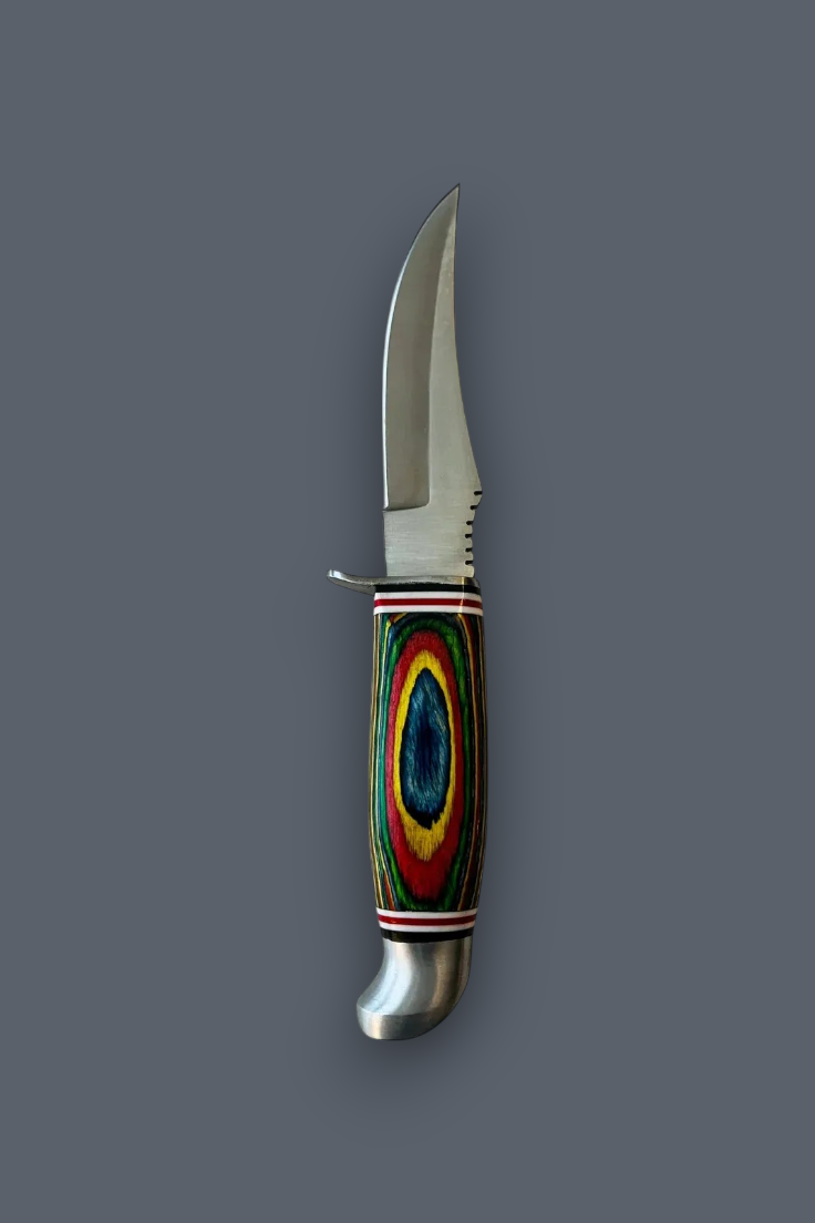 A fixed-blade knife with a curved silver steel blade and a colorful handle featuring concentric rings of blue, red, yellow, green, and black, set against a solid dark gray background.