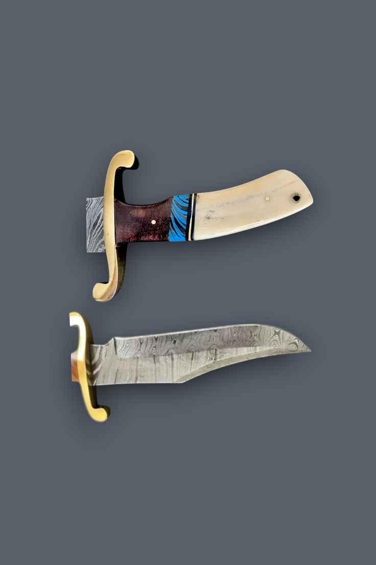 Two decorative knives with patterned steel blades, cream-colored handles, and gold-colored guard fittings, displayed against a solid dark gray background.