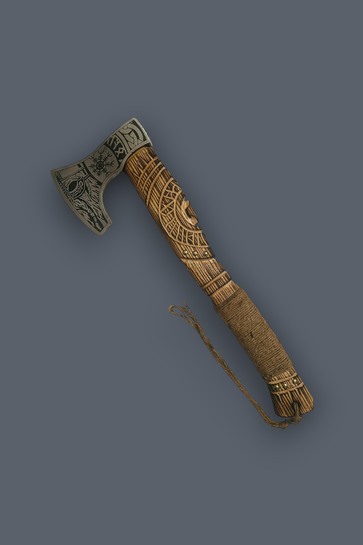 An ornate Viking-style axe with a carved wooden handle, detailed metal head, and a matching braided leather sheath on a solid dark gray background.