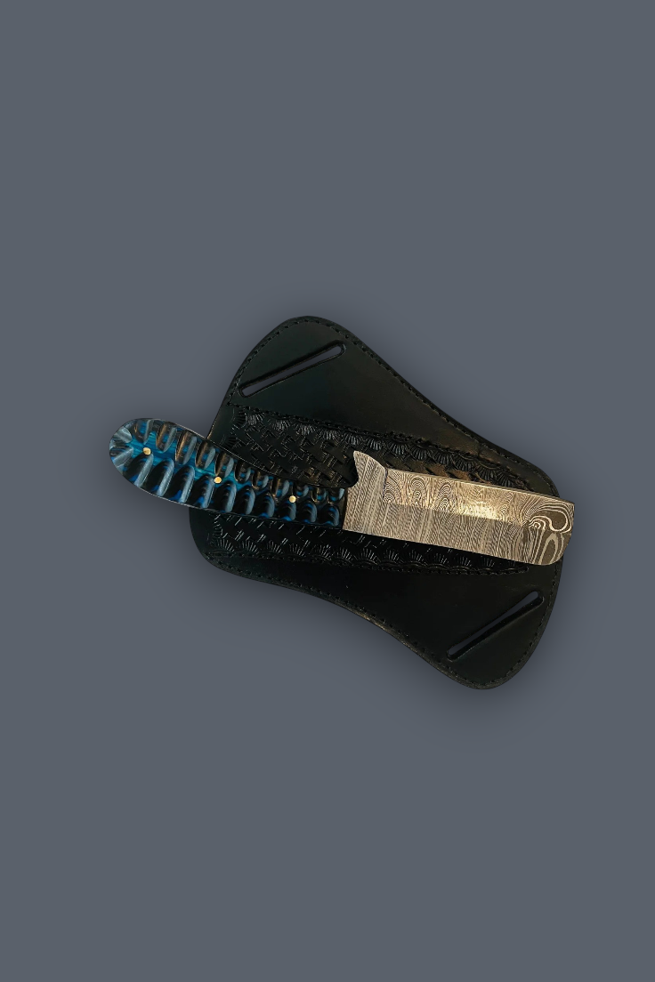 A fixed-blade knife with a textured blue handle and a brushed silver metal guard, shown partially inserted into a black sheath against a solid dark gray background.
