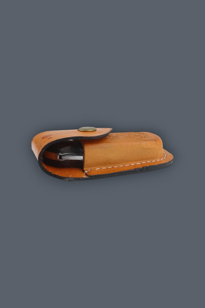 A tan leather knife sheath containing a knife, shown against a solid dark gray background.