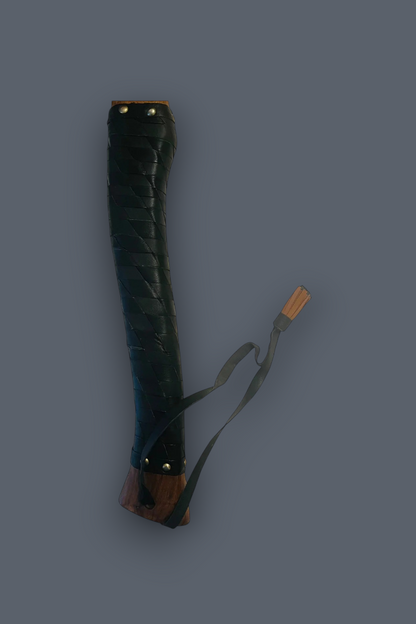 A dark green leather-wrapped sword scabbard with brown wooden end caps and a matching green strap, shown against a solid dark gray background.