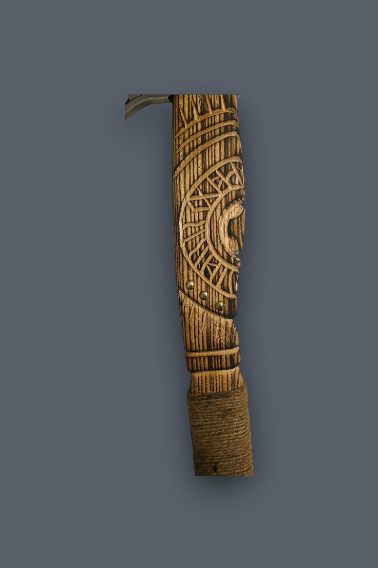 A carved wooden decorative object with intricate geometric and animal motifs, shown vertically against a solid dark gray background.