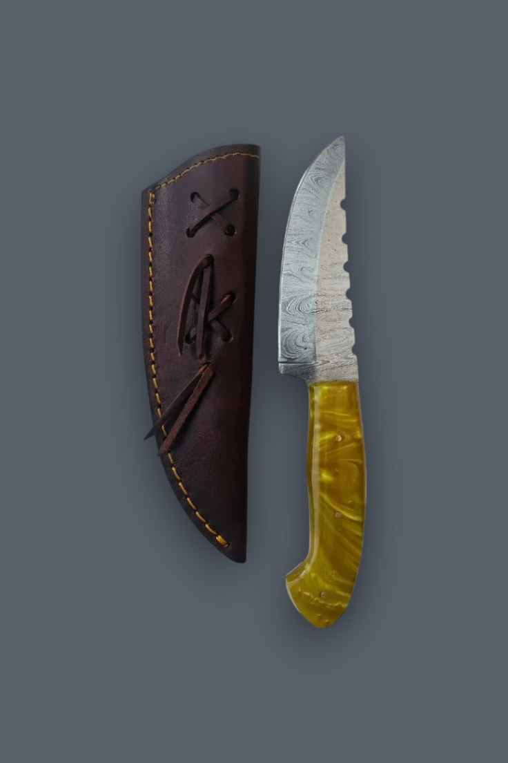 A fixed-blade knife with a patterned steel blade and a marbled yellow handle, shown next to its dark brown leather sheath on a solid gray background.