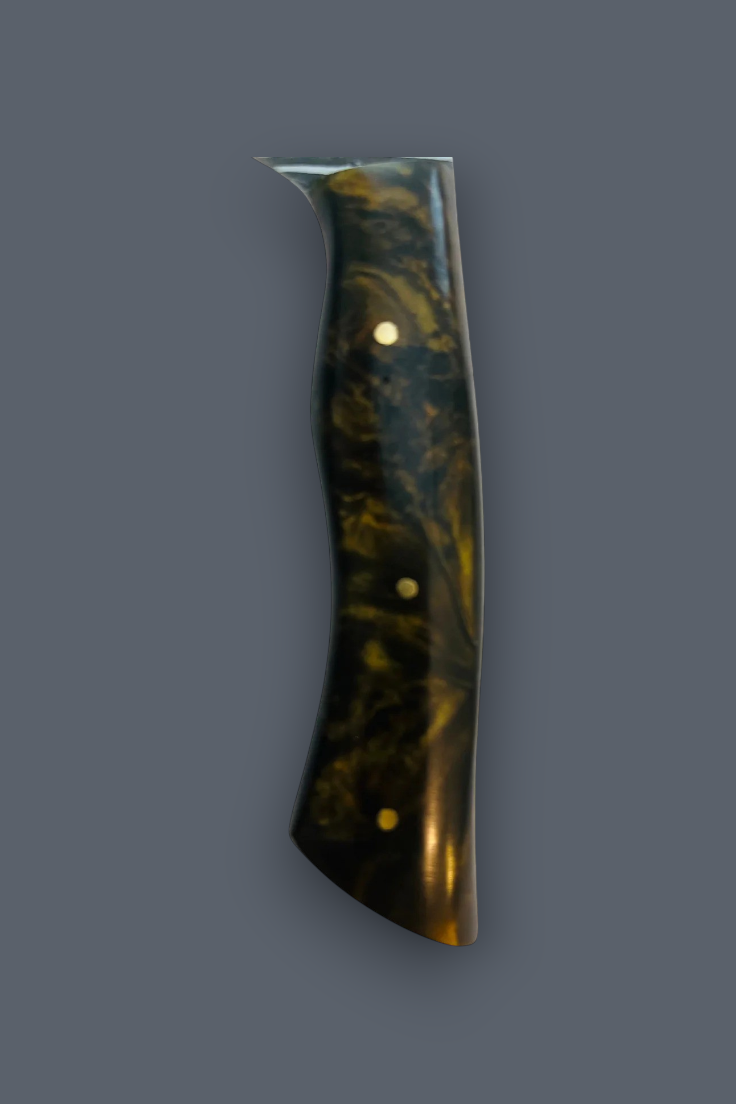 A single polished knife handle with a dark marbled pattern of black, brown, and gold, accented by four brass rivets, shown against a solid dark gray background.