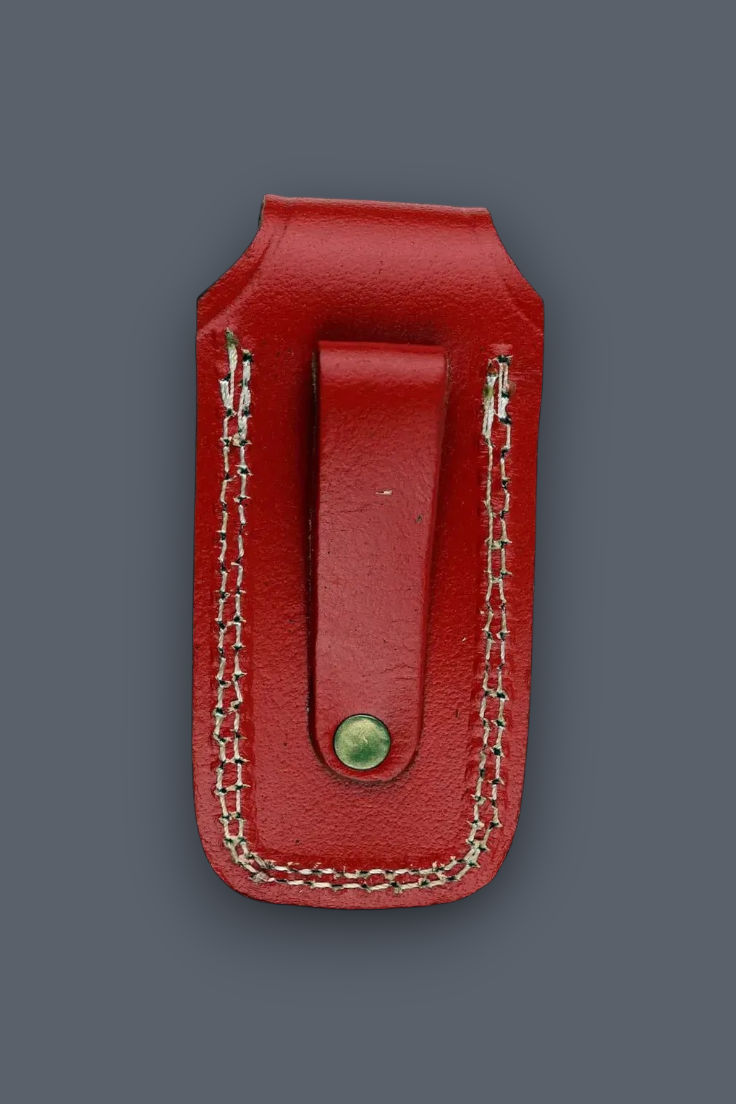 A red leather money clip wallet with light-colored contrast stitching and a small green button, shown against a solid dark gray background.