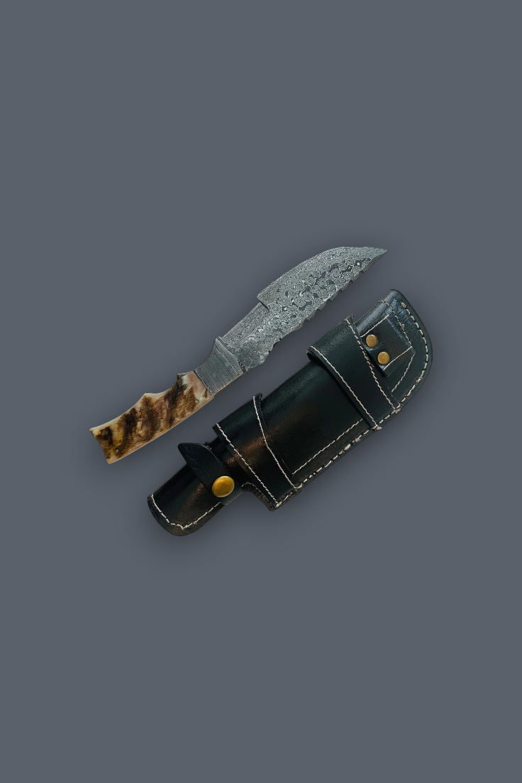 A fixed-blade knife with a patterned steel blade and a brown-and-black handle, shown next to a black leather sheath with brass snaps on a dark gray background.