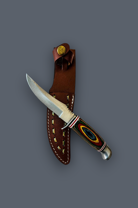 A fixed-blade knife with a silver blade and a colorful handle, displayed diagonally next to its brown leather sheath on a solid dark gray background.