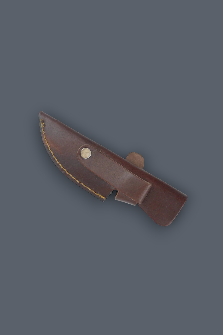 A dark brown leather knife sheath with a brass rivet, shown on a solid dark gray background.