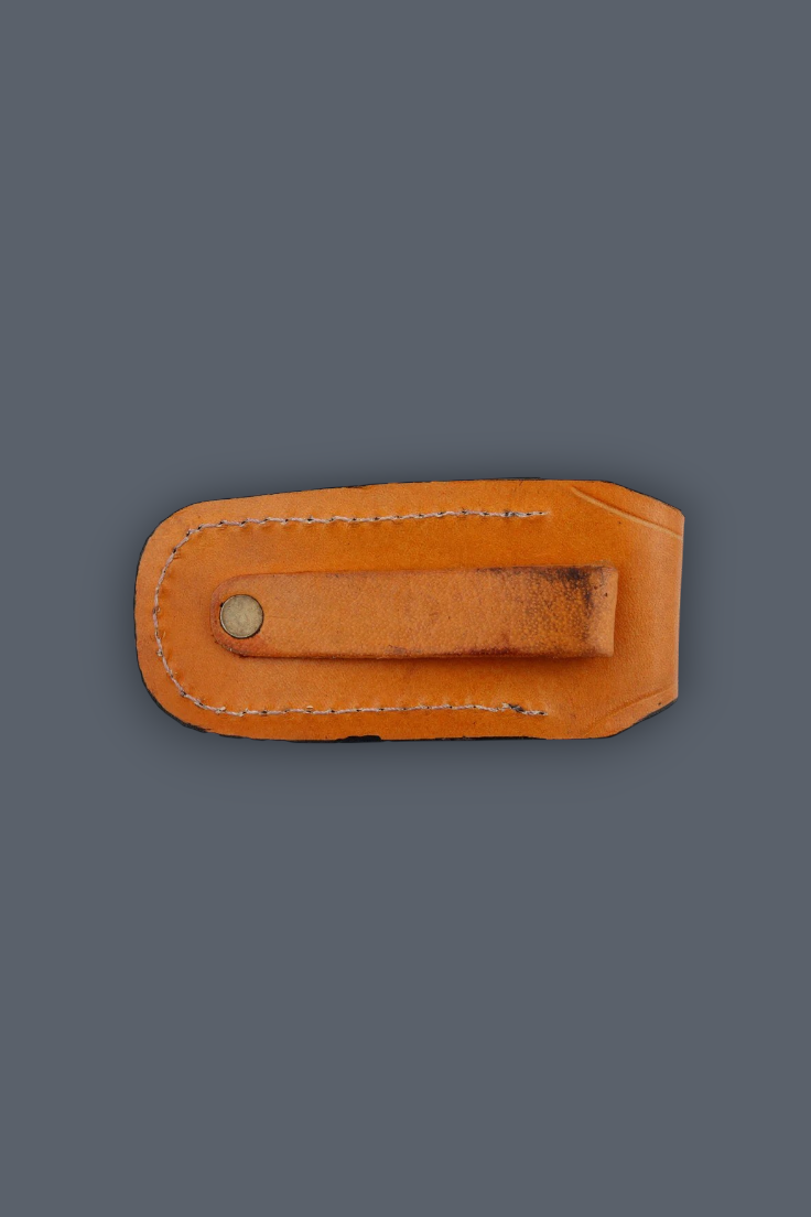 A light brown leather money clip with a metal snap button, shown flat against a solid dark gray background.