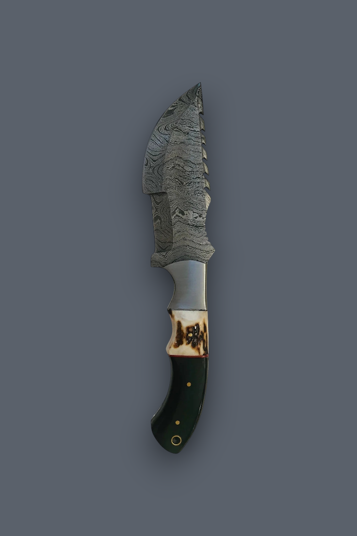 A fixed-blade knife with a patterned steel blade, a bone handle, and a dark green inlay, shown vertically against a solid dark gray background.
