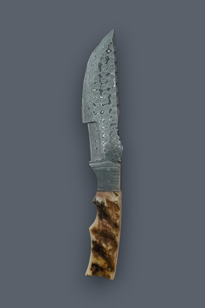 A fixed-blade knife with a patterned steel blade and a brown and beige bone or horn handle, shown vertically against a solid dark gray background.