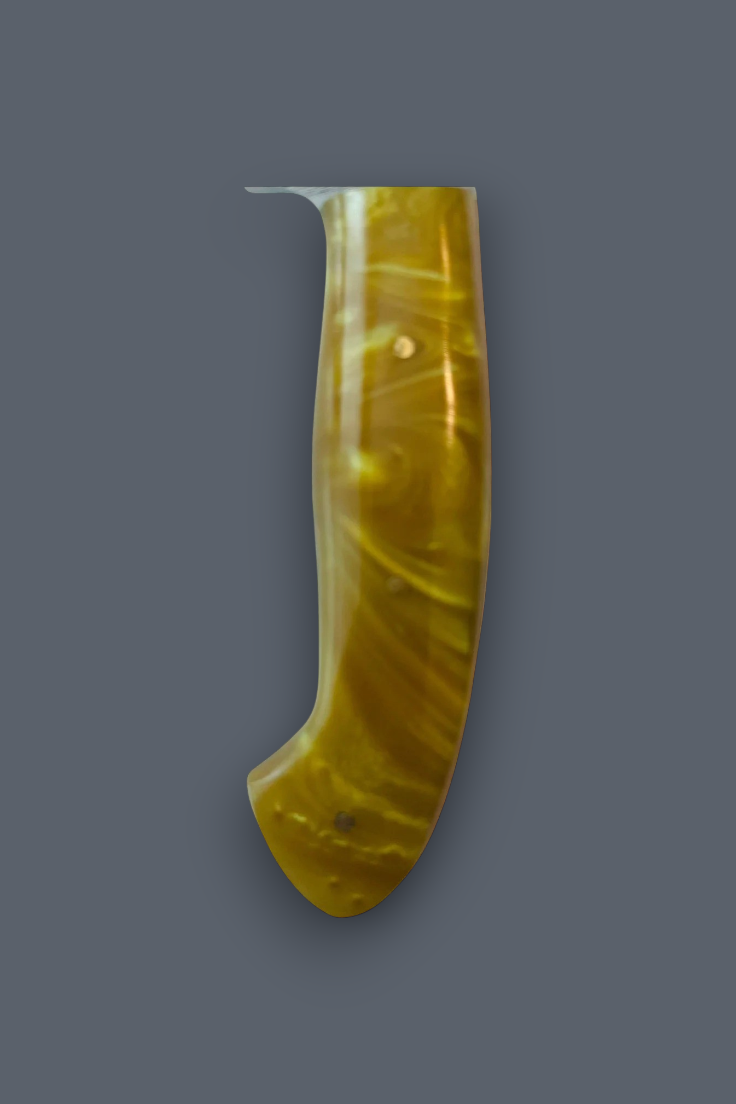 A single curved amber-yellow translucent object with a glossy finish, shown upright against a plain dark gray background.