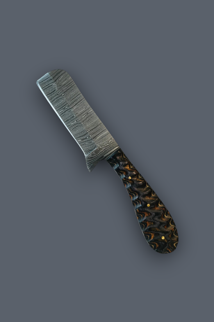 A custom kitchen knife with a textured, patterned steel blade and a dark, marbled handle featuring black, brown, and gold swirls, set against a solid dark gray background.
